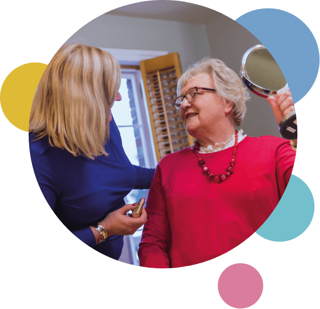 live-in-care_services_carer helping patient with their makeup live-in-care_services_carer helping patient with their makeup