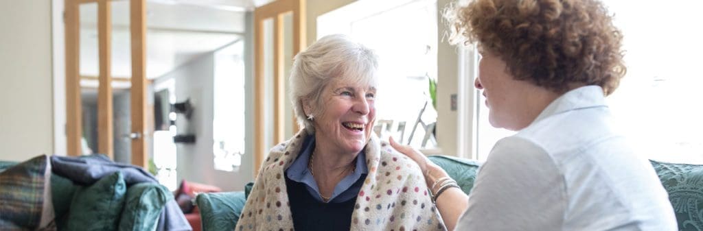 live nursing care_carer smiling with a patient
