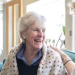 live nursing care_carer smiling with a patient