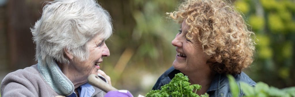 measuring well being_carer laughing with a patient