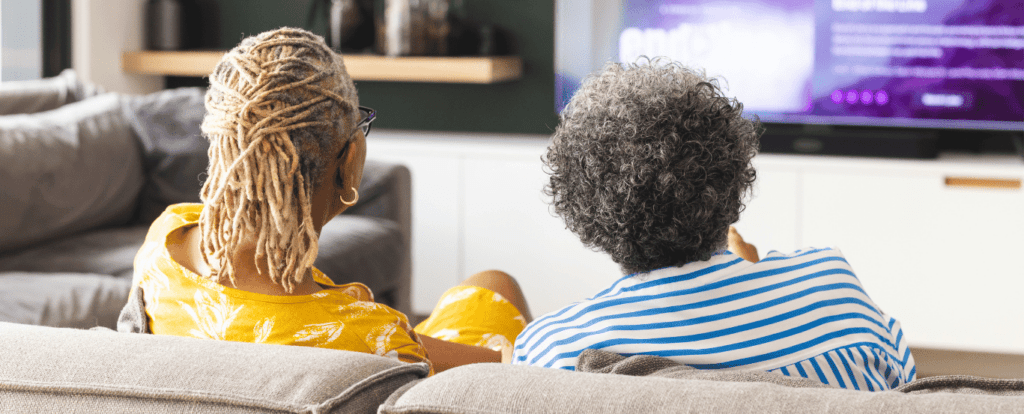 client and carer watching tv